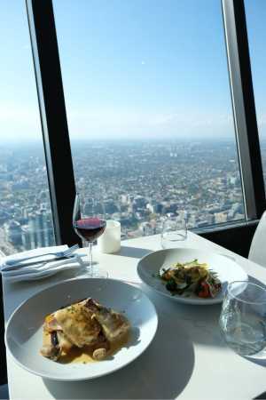 Chicken Coq au Vin, salad and a glass of wine at 360 Restaurant inside the CN Tower Chicken Coq au Vin, salad and a glass of wine at 360 Restaurant inside the CN Tower