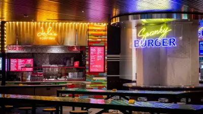 Queen's Cross Food Hall | The neon signs of Lala's Cantina and Swanky Burger