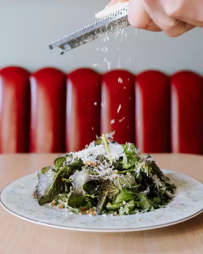 Ayla Upstairs | The Chrysanthemum Caesar salad uses sesame, miso, buckwheat and pecorino