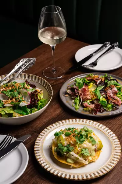 The Berczy Tavern | A spread of tostadas, salad and wine at The Berczy Tavern