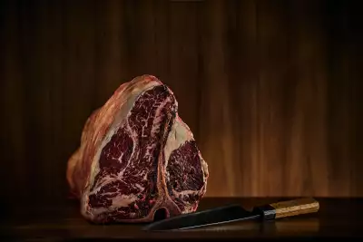Jacobs & Co. Steakhouse | A T-bone steak and a sharp knife at the new Jacobs & Co. Steakhouse