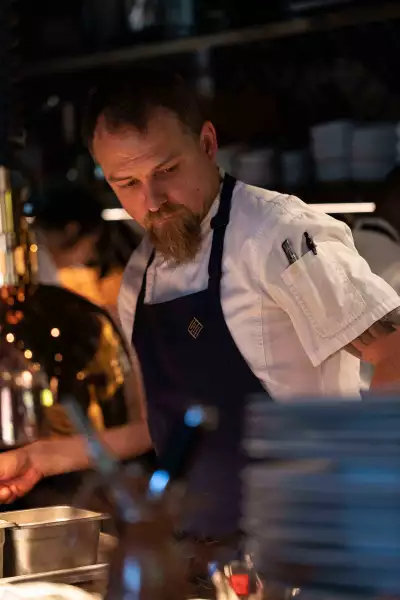 Enigma Yorkville | Executive chef Quinton Bennett mid-service at Enigma Yorkville