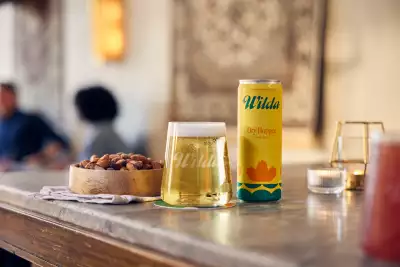Revel Cider and Wilda team up | A glass and can of Wilda's Dry Hopped Honey Brew Revel Cider and Wilda team up | A glass and can of Wilda's Dry Hopped Honey Brew