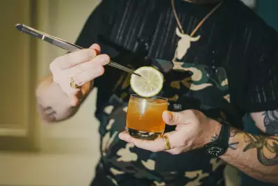 Toronto Cocktail Festival | A bartender tweezes a slice of lime onto a cocktail