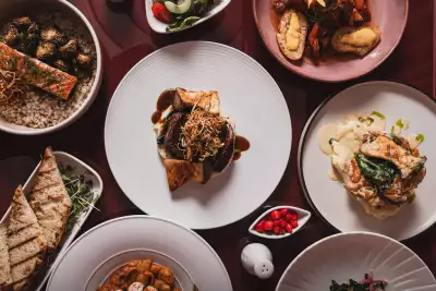 Deauville Club | An overhead shot of collection of French, Italian and Spanish-inspired dishes at Deauville Club inside the Revery Hotel