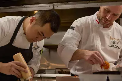 Deauville Club | Chef Justin Raponi (right) and a team member at Deauville Club inside the Revery Hotel