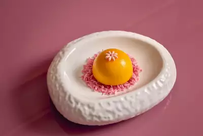 Deauville Club | The Mango Passionfruit Charlotte Dome dessert at Deauville Club inside the Revery Hotel