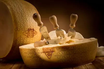 Prosciutto di Parma PDO and Grana Padano PDO cheese | Grana Padano wheel and cheese knife