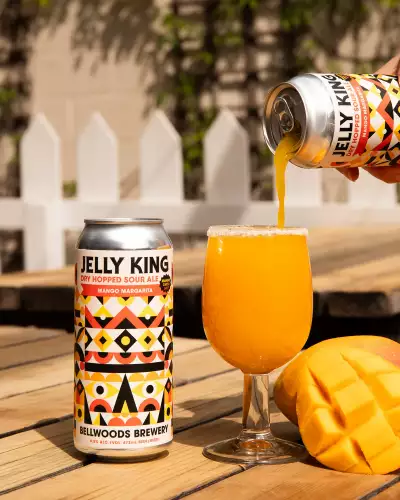 Bellwoods Jelly King | A glass and a can of Jelly King Mango Margarita Sour on the patio at Bellwoods Brewery on Ossington