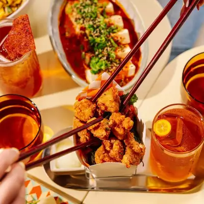Where to watch the FIFA World Cup in Toronto | Chopsticks reach for a fried chicken bite at Simpl Things in Parkdale