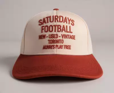 Where to watch the FIFA World Cup in Toronto | A red and white hat thats reads 'Saturdays Football New-Used-Vintage Toronto Always Plays Free' available at Ace Hotel Where to watch the FIFA World Cup in Toronto | A red and white hat thats reads 'Saturdays Football New-Used-Vintage Toronto Always Plays Free' available at Ace Hotel