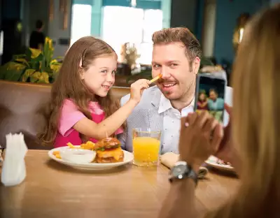 Win a Visa gift card | Father and daughter at a restaurant