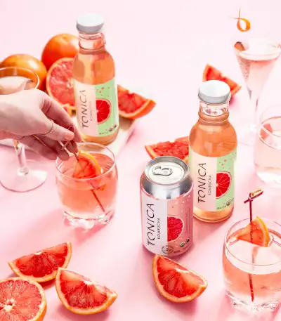 Bottles and glasses of Tonica Grapefruit Kombucha Bottles and glasses of Tonica Grapefruit Kombucha