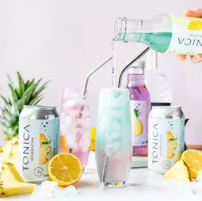Pouring Tonica Lemonade Kombucha into a glass Pouring Tonica Lemonade Kombucha into a glass