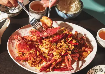 Toronto food and drink Instagram creators | A hand uses chopsticks to dish up food at Hong Shing Dining Room