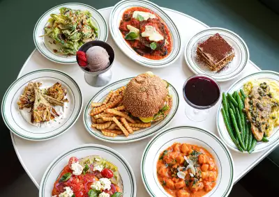 A spread of burger and fries, pasta, tiramisu and more on Stefano's Diner's summer prix fixe menu