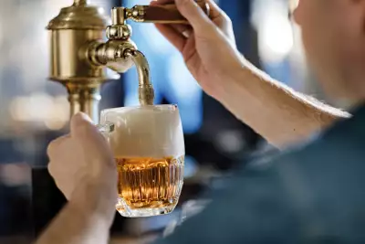 Pouring a glass of Pilsner Urquell