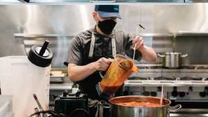 Toronto restaurant industry recovery | A cook dons a mask while he works at Ascari on King Toronto restaurant industry recovery | A cook dons a mask while he works at Ascari on King