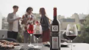 Graffigna | A bottle of Graffigna and wine glasses at a party Graffigna | A bottle of Graffigna and wine glasses at a party