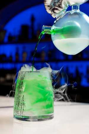 Offworld bar | Pouring green liquid into the Hivemind cocktail at Offworld bar on Queen West Offworld bar | Pouring green liquid into the Hivemind cocktail at Offworld bar on Queen West