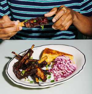 Eating a plate of ribs at The Drake Eating a plate of ribs at The Drake