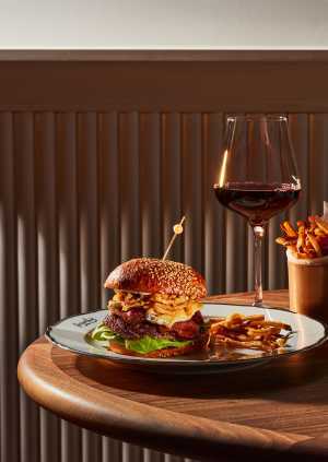 Frenchy Toronto | The hamburger and a glass of red wine at Frenchy Toronto Frenchy Toronto | The hamburger and a glass of red wine at Frenchy Toronto