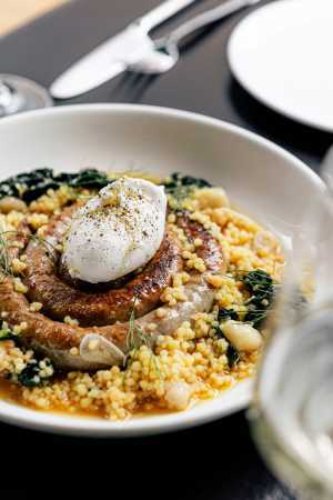 The best brunch in Toronto | Braised pork barese sausage with bone marrow and a poached duck's egg at Buca Yorkville The best brunch in Toronto | Braised pork barese sausage with bone marrow and a poached duck's egg at Buca Yorkville