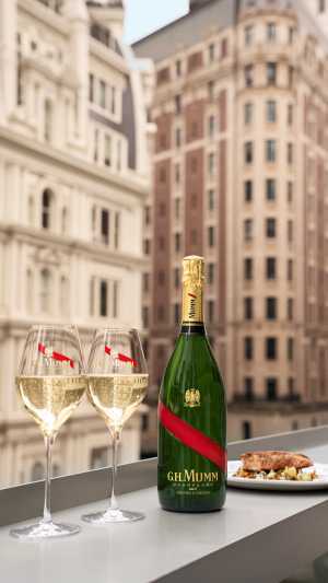 G.H.Mumm | Two glasses of champagne and a bottle of G.H.Mumm sit on a windowsill G.H.Mumm | Two glasses of champagne and a bottle of G.H.Mumm sit on a windowsill