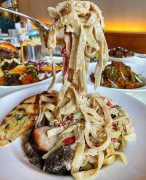 ByBlacks Restaurant Week 2025 | Jerk chicken fettuccine at Sugarkane Caribbean & Cajun Cuisine