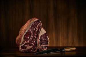 Jacobs & Co. Steakhouse | A T-bone steak and a sharp knife
