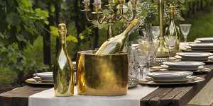 Bottega Gold | A dining table with bottles of Bottega Gold and an icebucket