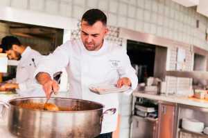 Don Alfonso's urban farm at Casa Loma | Executive chef Davide Ciavattella stirs a pot of tomato sauce Don Alfonso's urban farm at Casa Loma | Executive chef Davide Ciavattella stirs a pot of tomato sauce