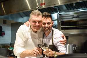 Q&A with the Charlies Burgers' founders | Dario Cecchini and Franco Stalteri pose with wine at a Charlies Burgers dinner