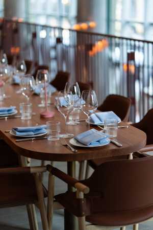 Oretta Downtown | A table set with wine glasses on the mezzanine level at Oretta Downtown