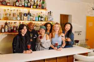 Cody Wilkes Simpl Thing | The Simpl Things team pose behind the bar Cody Wilkes Simpl Thing | The Simpl Things team pose behind the bar