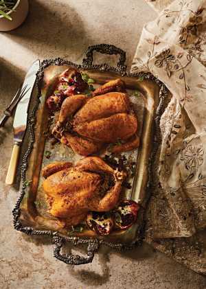 3 tasty Middle Eastern recipes | Two chickens on a platter in Thuraya cookbook