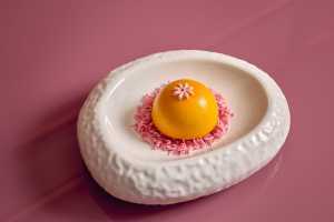 Deauville Club | The Mango Passionfruit Charlotte Dome dessert at Deauville Club inside the Revery Hotel