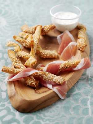 Prosciutto di Parma PDO and Grana Padano PDO cheese | Cheese straws wrapped in Prosciutto di Parma PDO