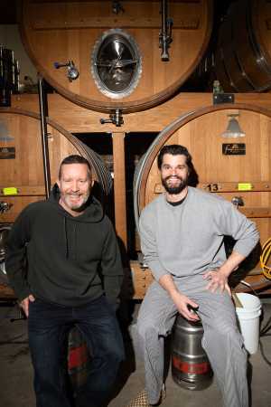Bellwoods Jelly King | Mike Clark and Luke Pestl, co-founders of Bellwoods Brewery, pose inside in front of a beer tank