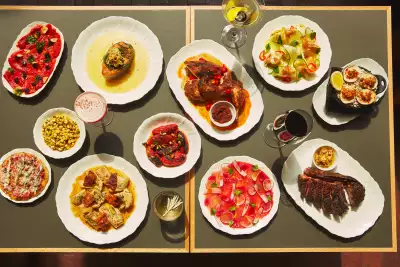 Q&A with Patrick Kriss of Alo, Alobar and Alder | A spread of dishes at Alder