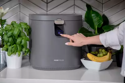 Pressing a button on the FoodCycler by Vitamix Eco 5