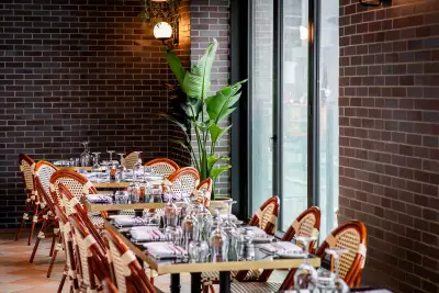 La Plume Toronto | Set tables with bistro chairs at La Plume in The Well