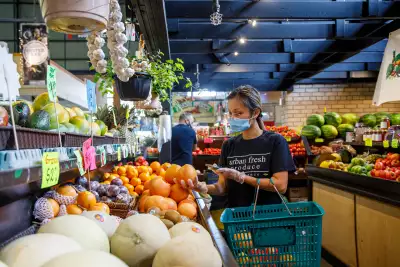 A woman shopping at St. Lawrence Market in Toronto