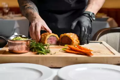 Black and Blue steakhouse Toronto | Opening a beef wellington at Black and Blue