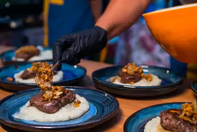 Indigenous food experiences in Canada | Plates of bison at a Han Wi Moon Dinner in Saskatoon, Saskatchewan