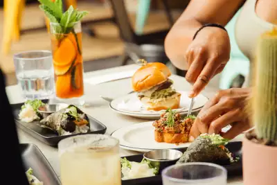 Someone cuts into steak tartare at the Drake Cafe