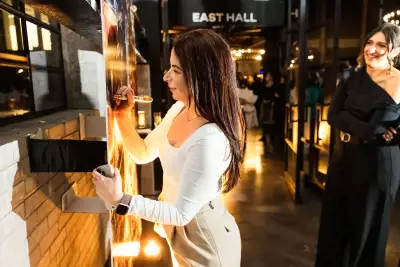 The 2024 foodism ICON Awards | Someone signs the foodism cover at the foodism ICON Awards