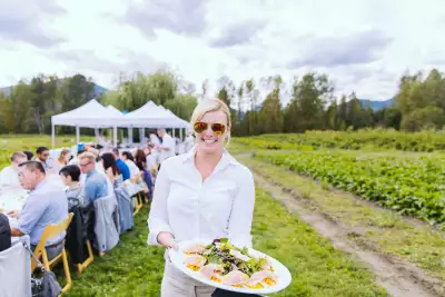 Outdoor dining experiences in Canada | A server at the Araxi Longtable Dinner in Pemberton, B.C.