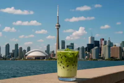 Matcha cafés, lattes and treats in Toronto | A matcha latte against the Toronto skyline