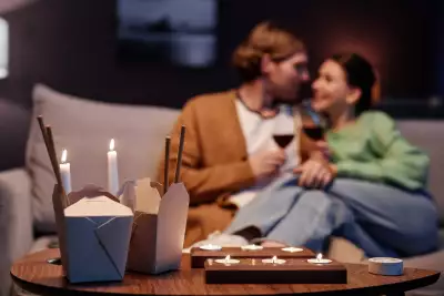 Toronto takeout and wine pairings | A couple with takeout boxes